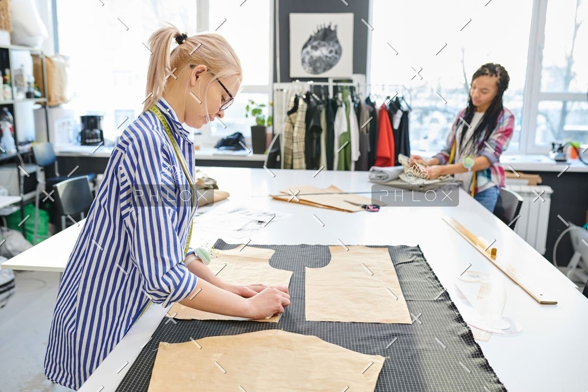 demo-attachment-452-dressmakers-working-in-atelier-8FJWN2X